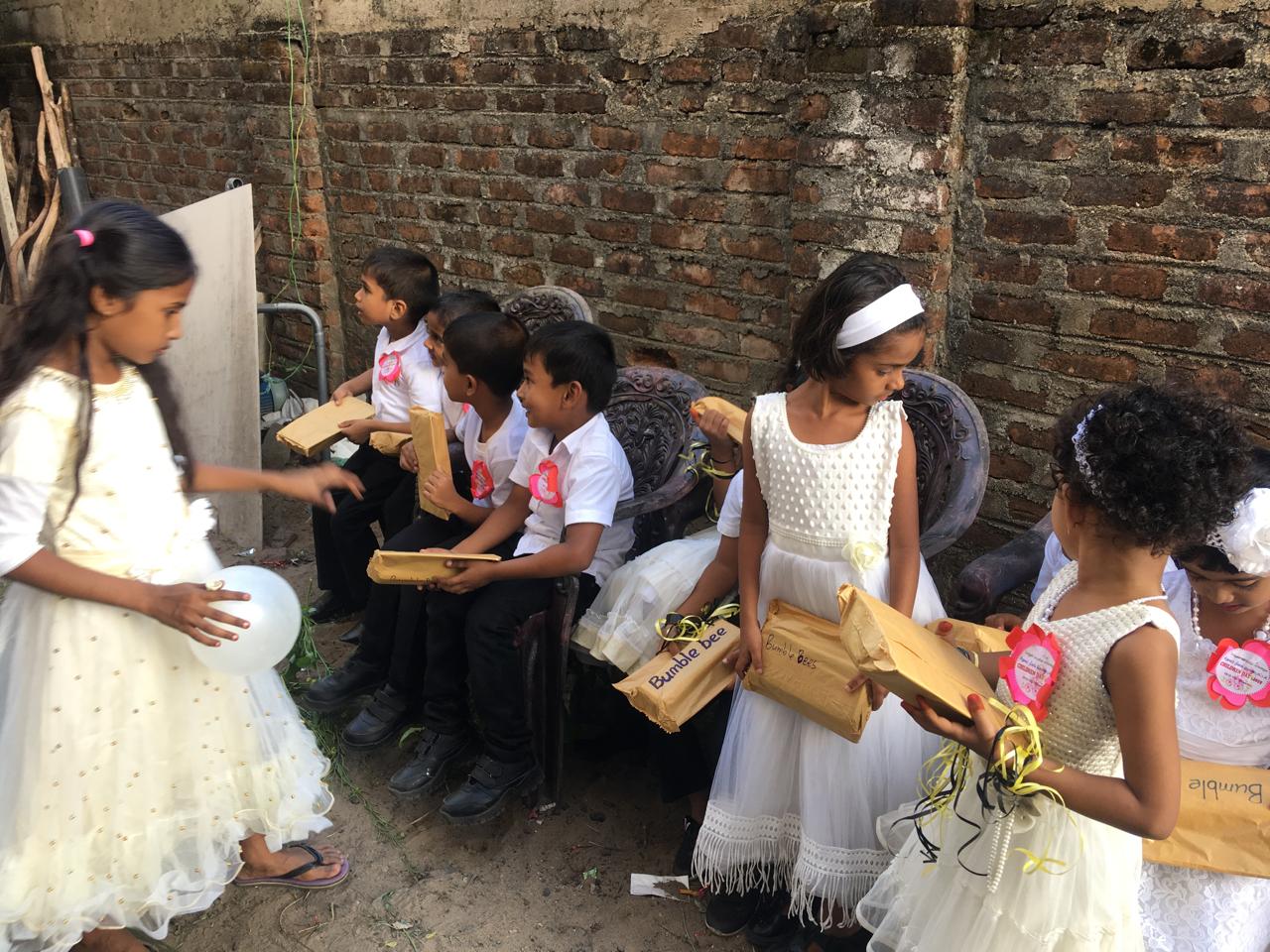 Children taking part in a classroom celebration at Pottuvil Osmaniya school.