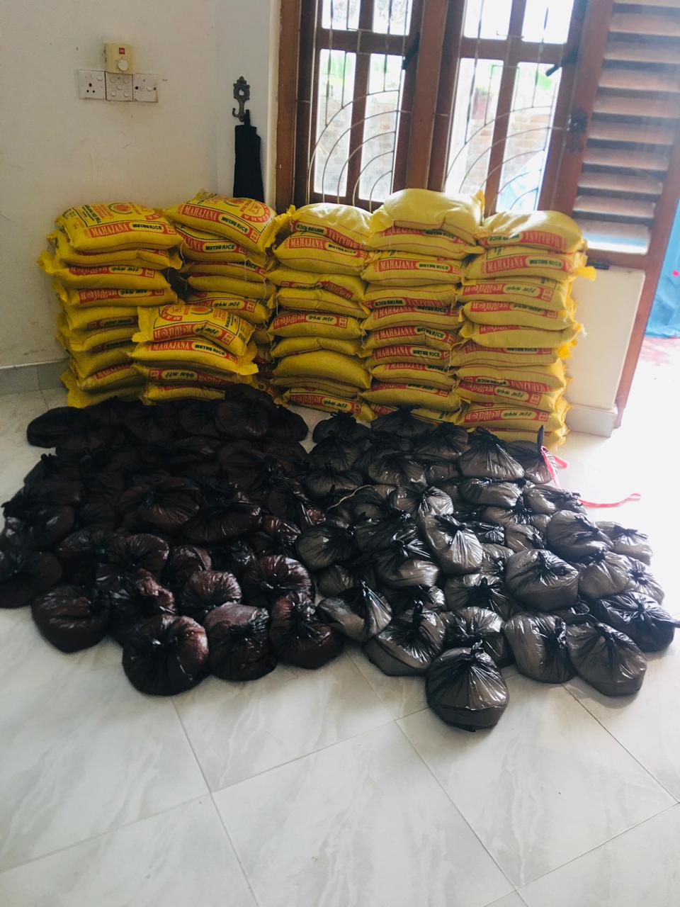 Rice sacks and prepared household food parcels in Pottuvil.