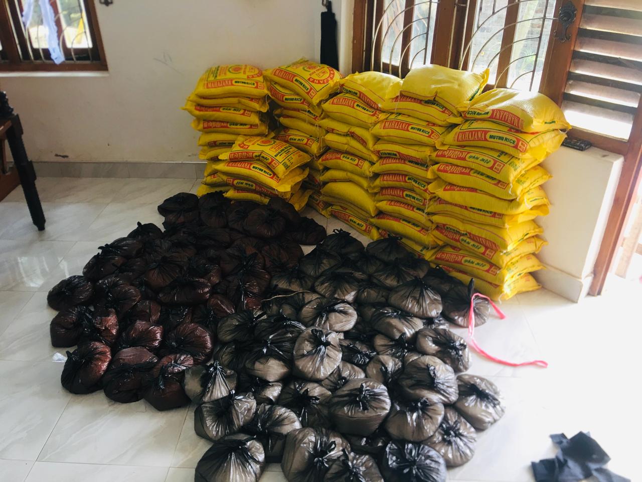 Rice sacks and prepared food parcels for a family-support activity in Pottuvil.